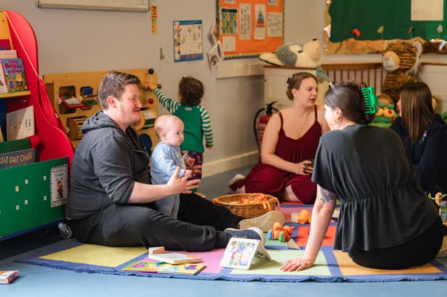 Parents and children sitting and talking